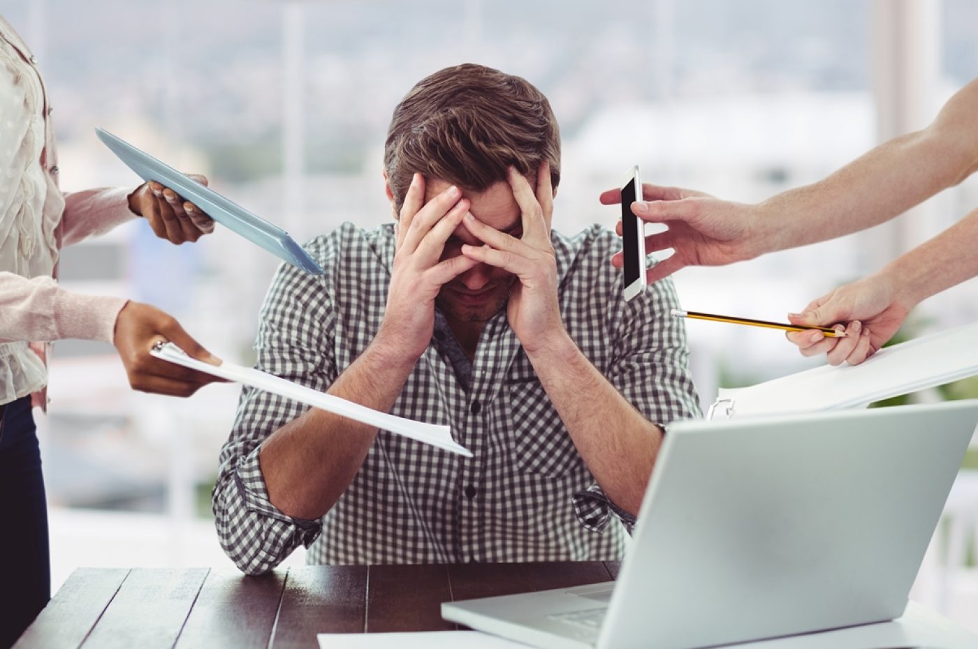 Stressed man frustrated with electronic devices